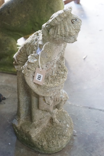 A reconstituted stone garden ornament of a lady with a basket of flowers, height 72cm